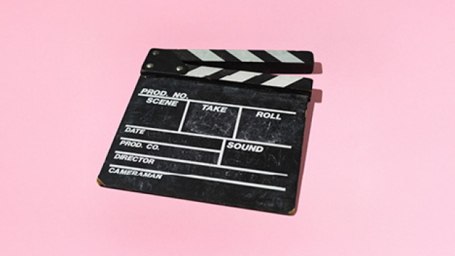 Blank slate board on a pink background